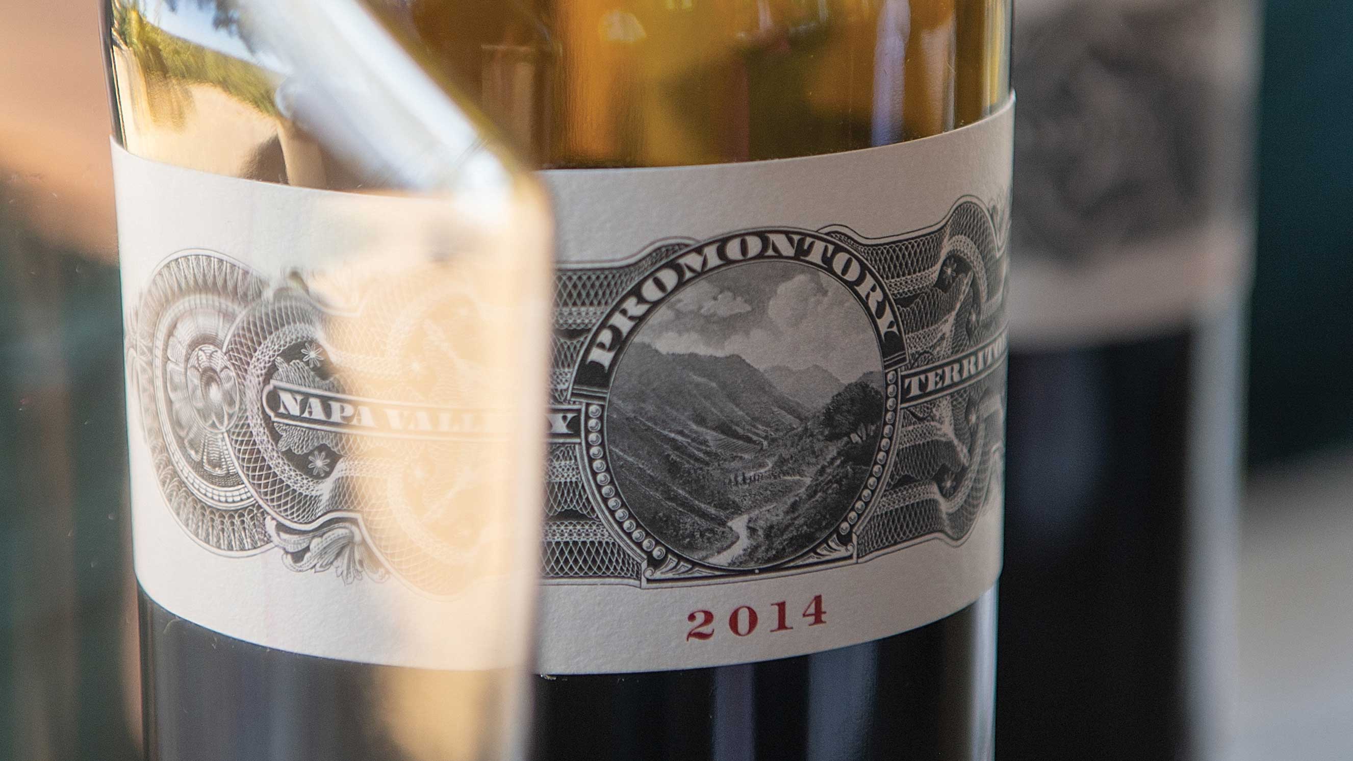 Promontory Winery 2014 vintage bottle label, with intricate detailing and the Napa Valley designation, highlighting the region's renowned winemaking heritage.