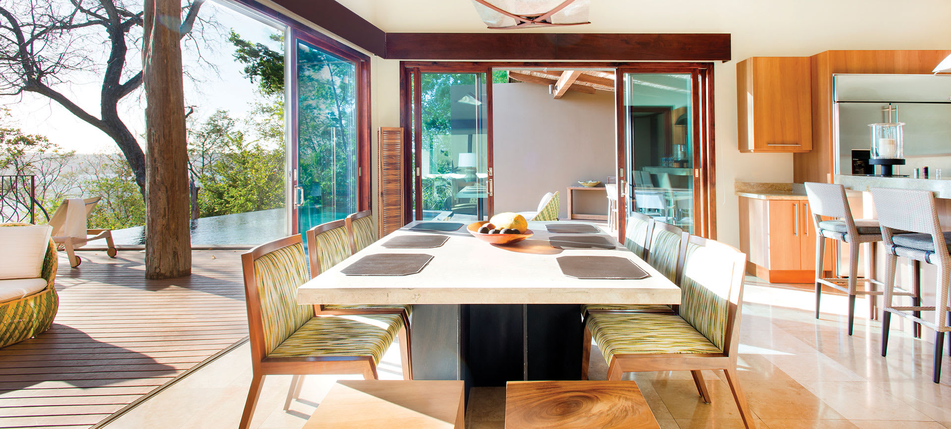 indoor outdoor kitchen with dining table