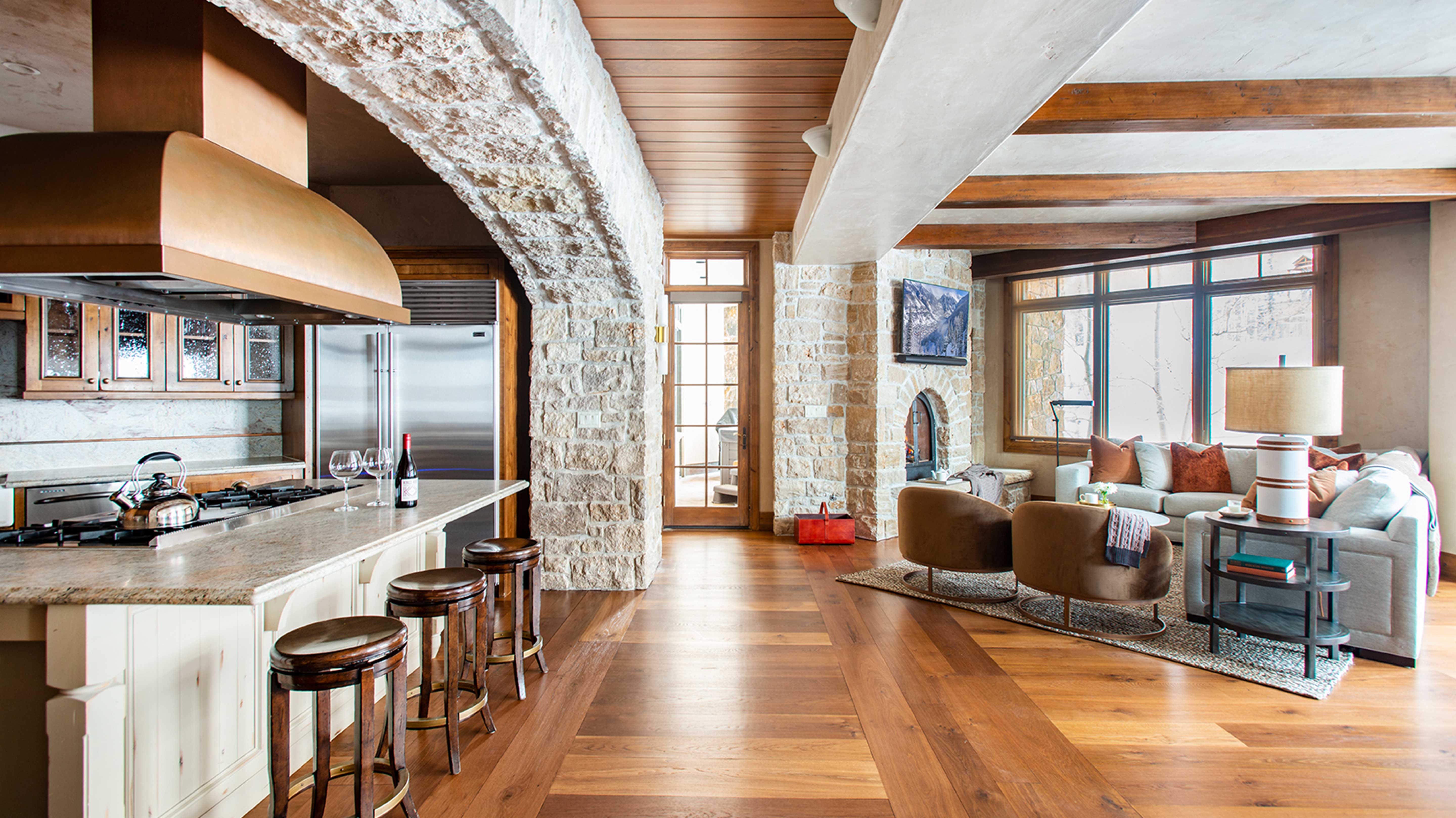 Exclusive Resorts property living room at Heritage Crossing in Telluride, Colorado with a cozy seating area and large windows.