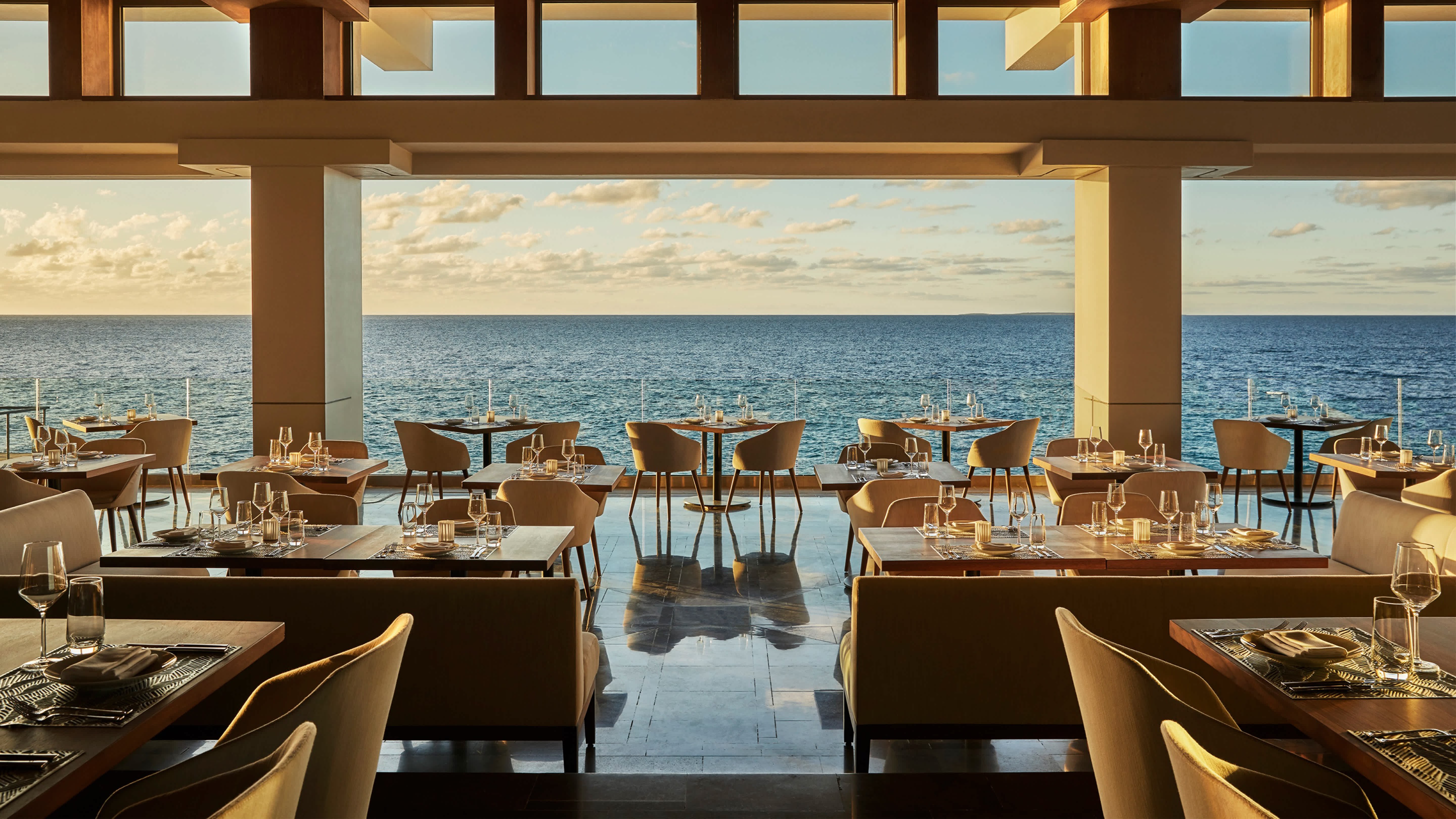The inside of a restaurant looking out at the ocean in Anguilla.