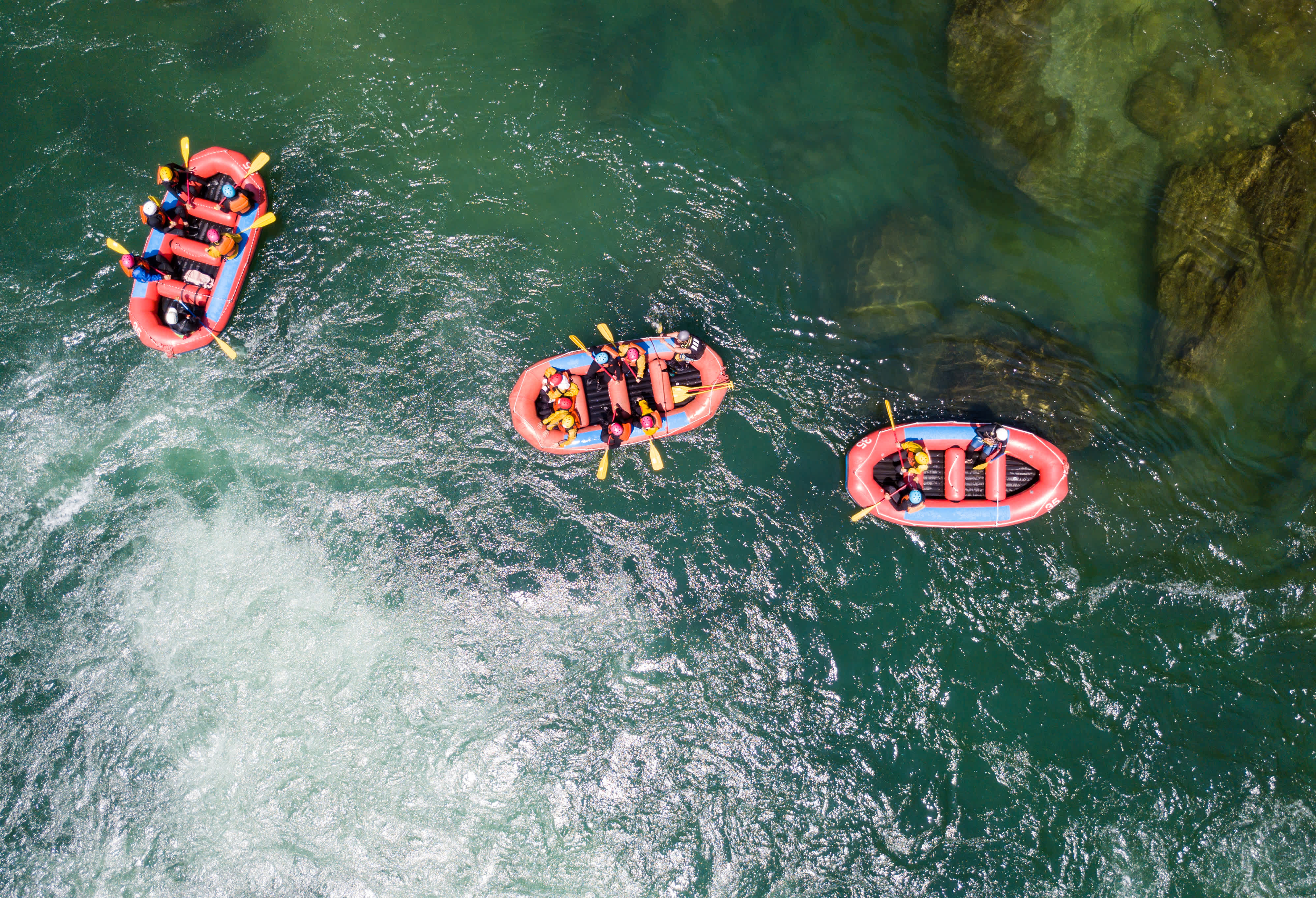 Three rafts in a river.