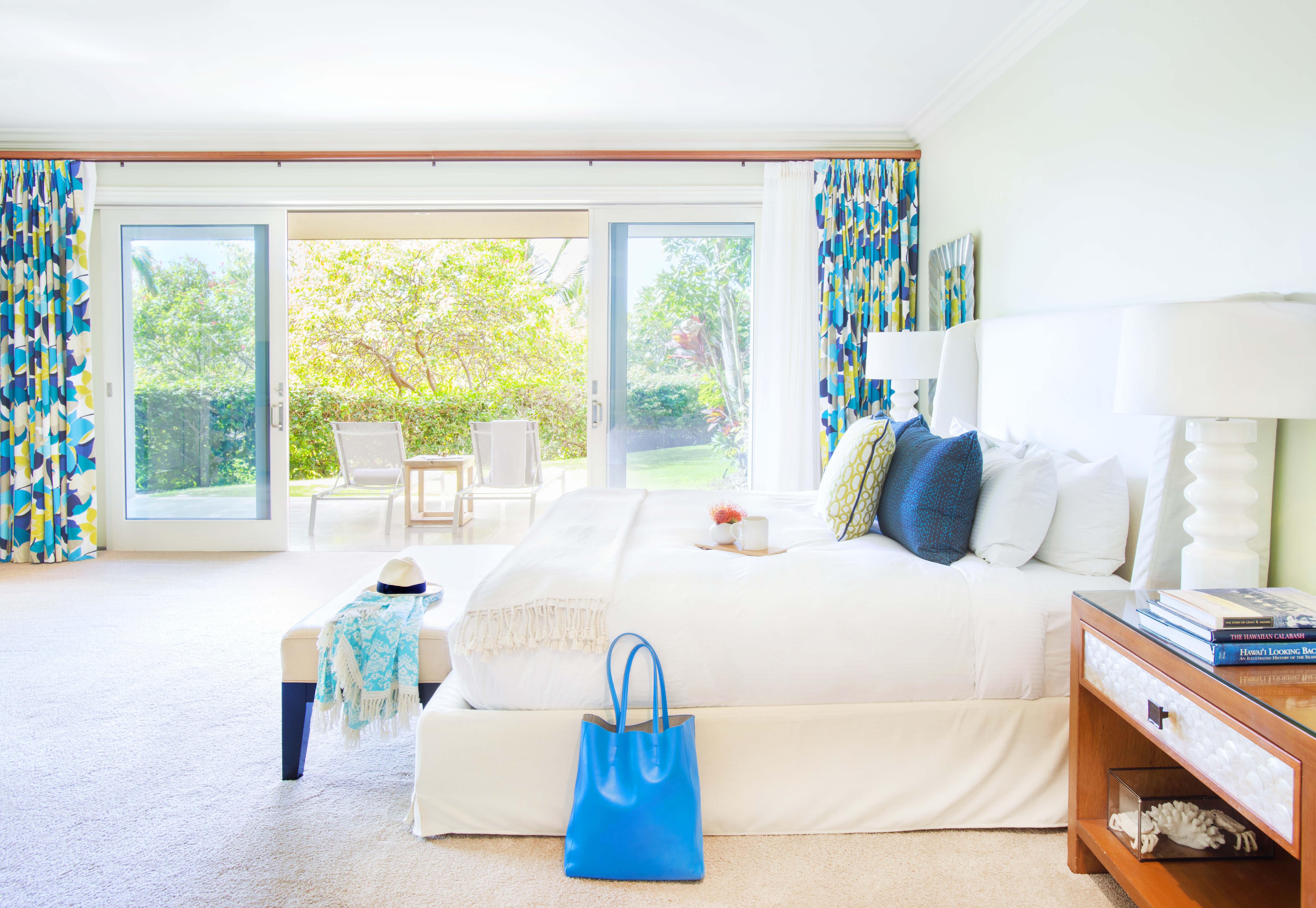 Spacious and bright bedroom with floor-to-ceiling windows in an Exclusive Resorts home in Wailea.