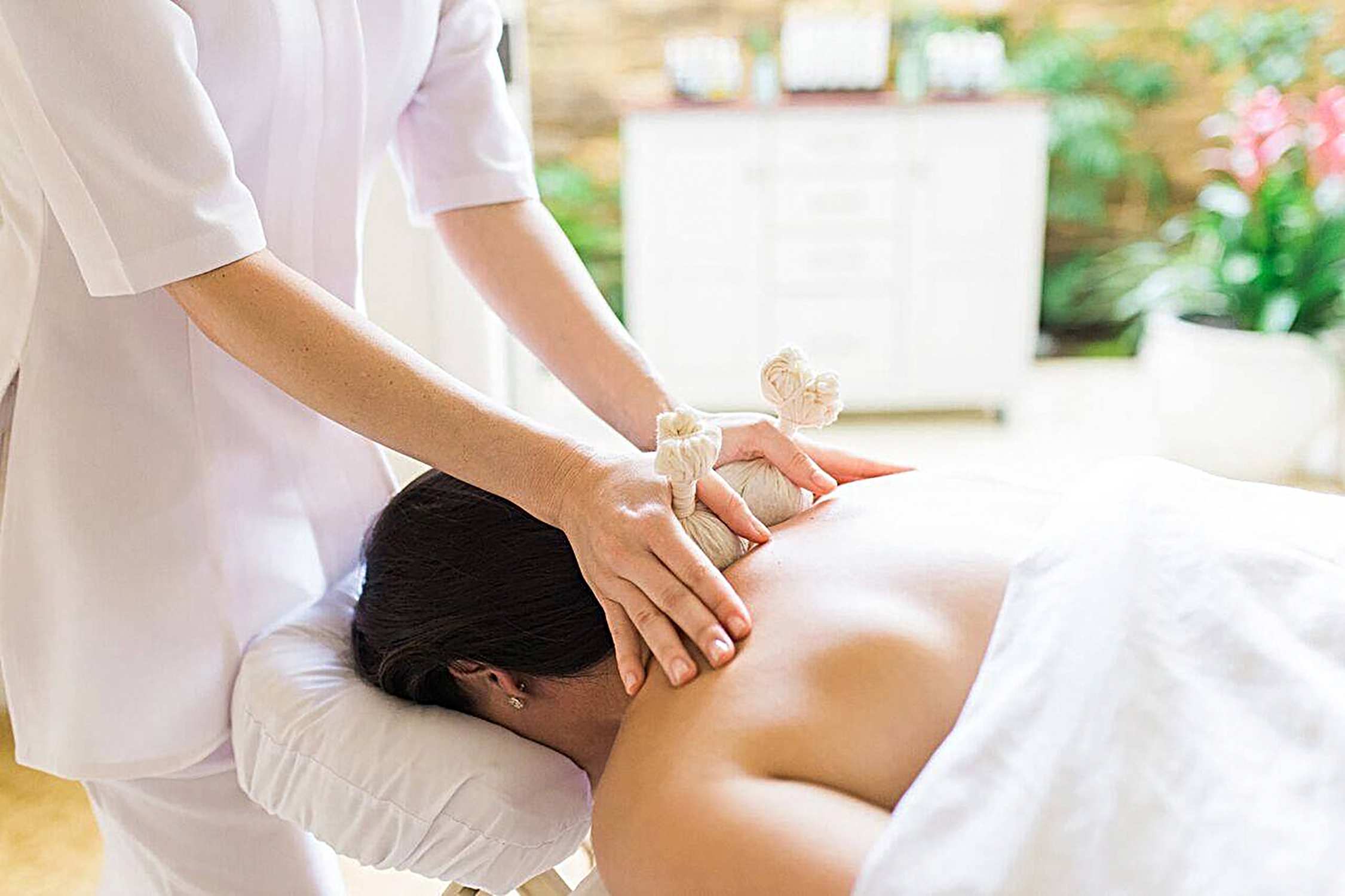 A woman receiving a massage.
