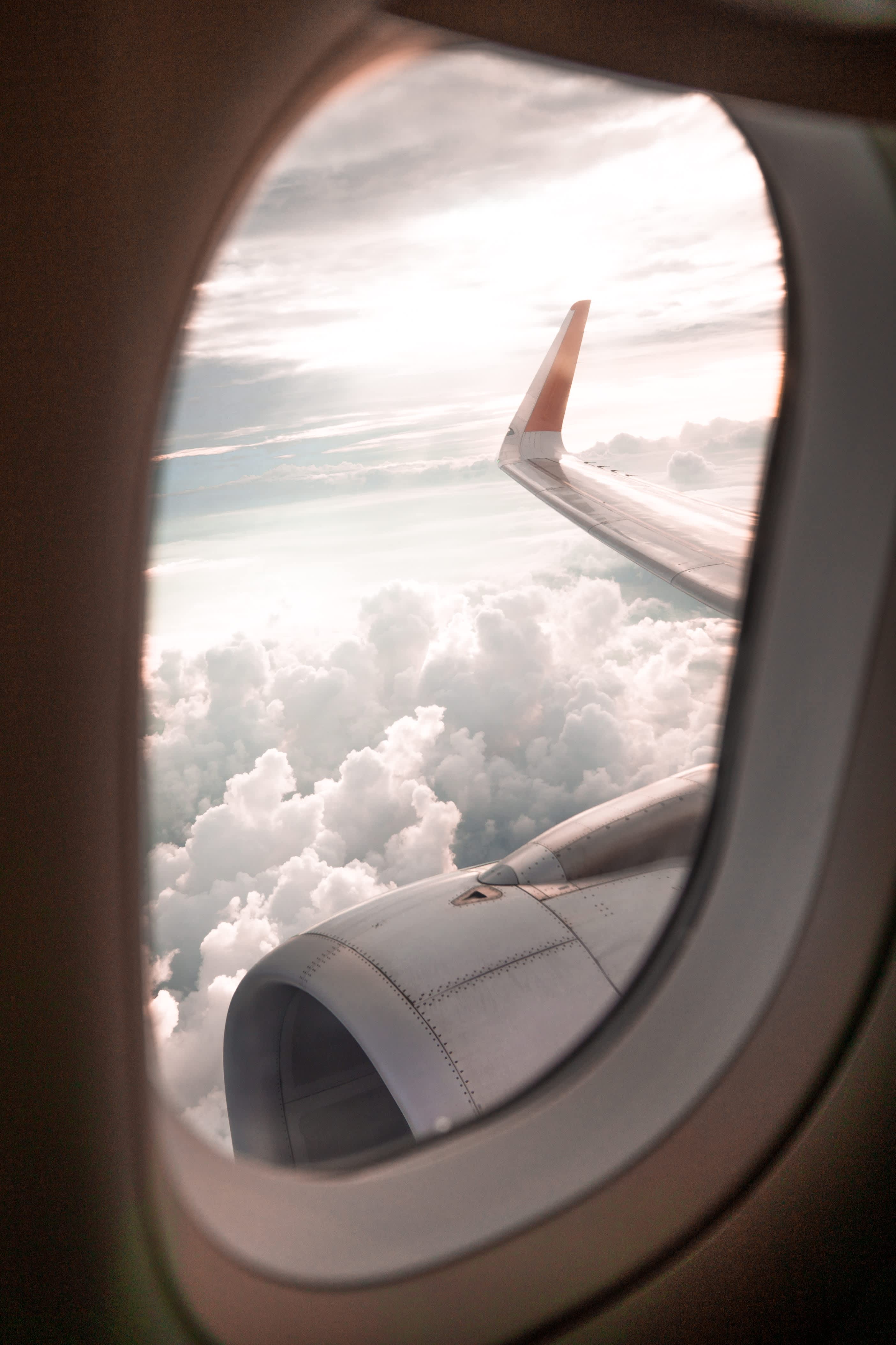 View of the clouds out of a plane's window.