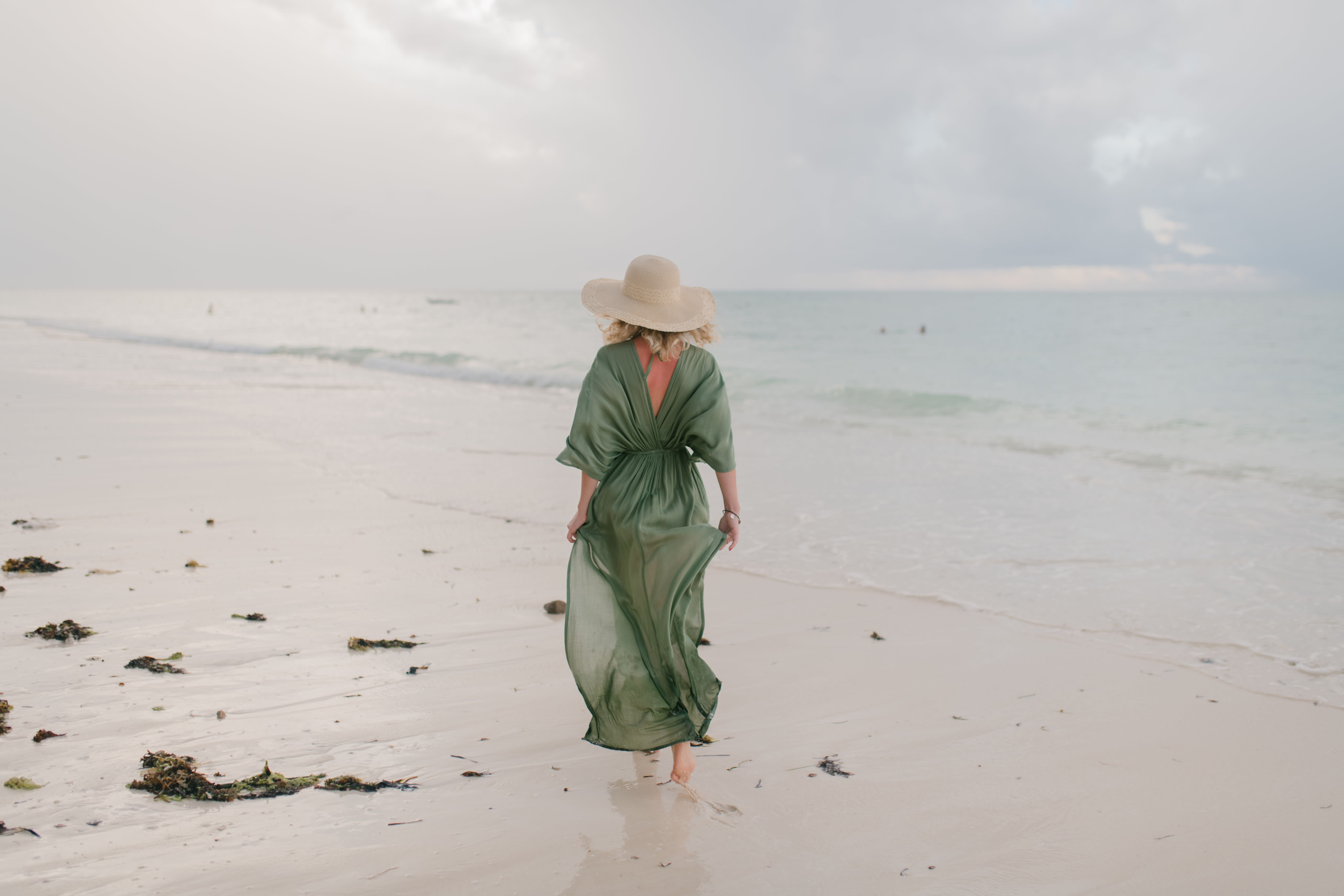 Woman walking on the beach.