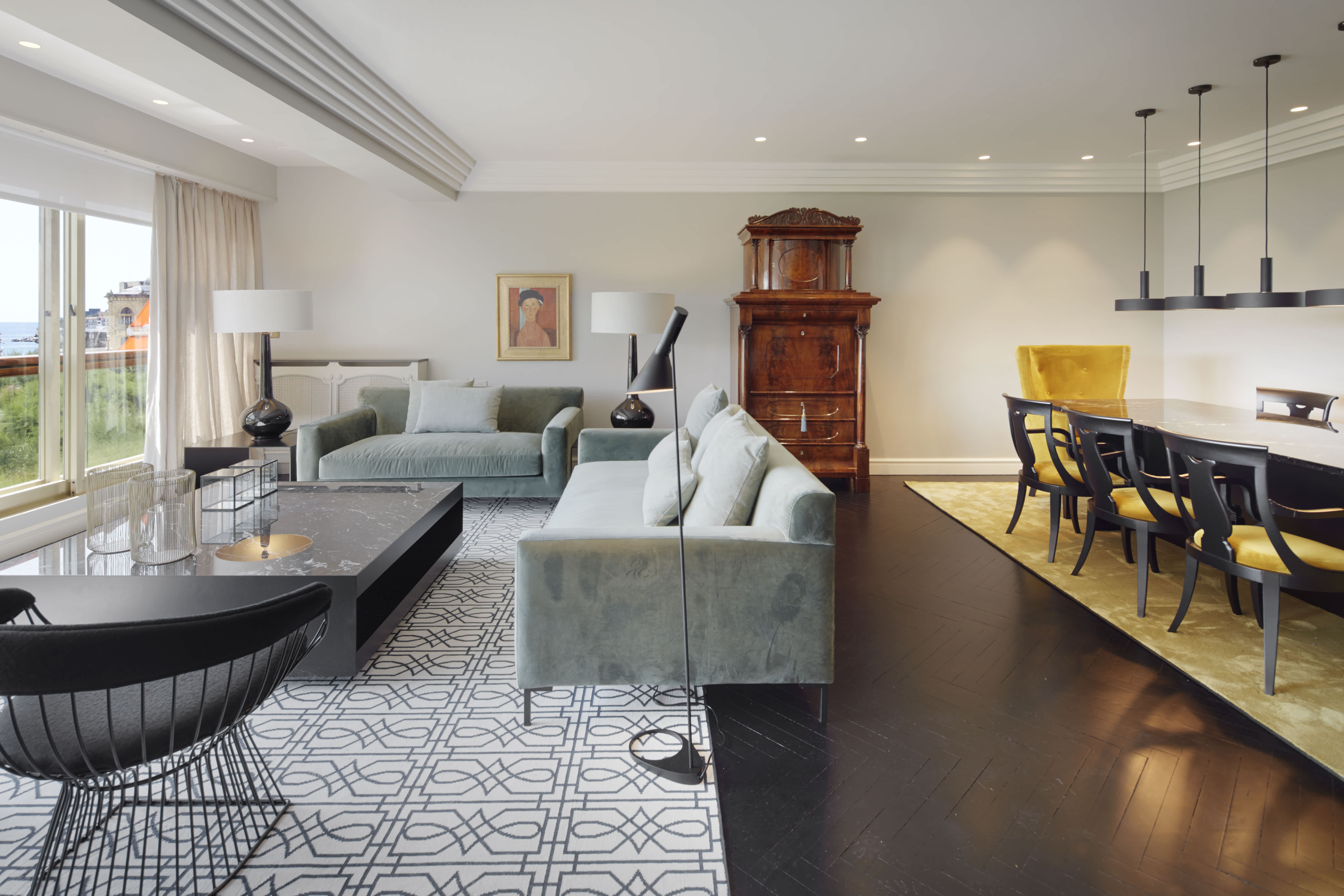 Exclusive Resorts' villa in San Sebastián, Spain, featuring a modern living and dining area with ocean views.