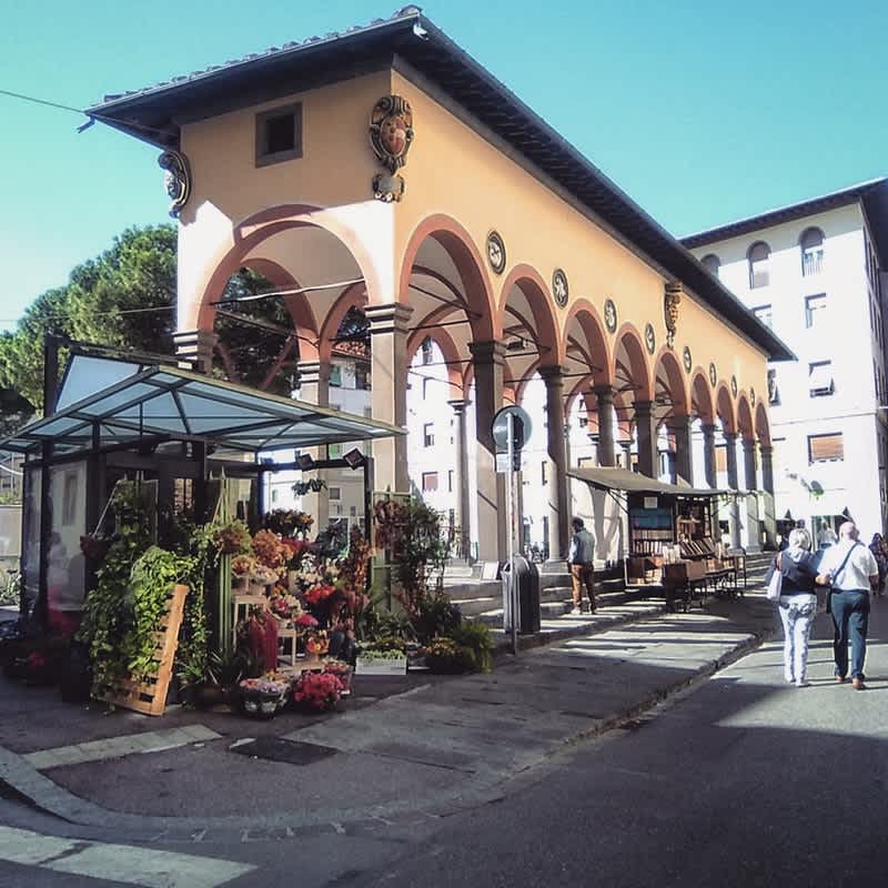 Historic building with arches in Florence, Italy, on a sunny day