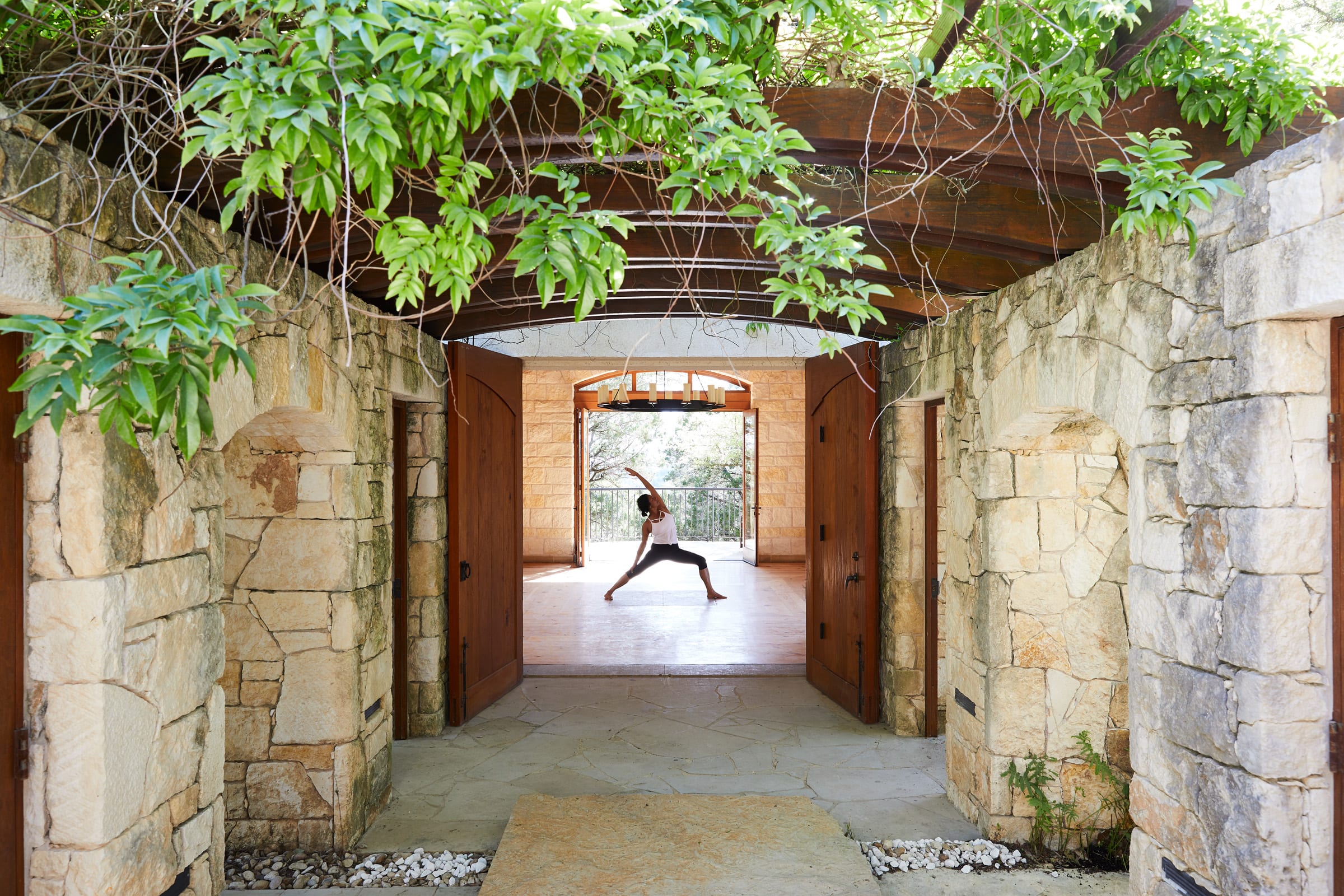 Yoga in a serene, open-air yoga studio at Miraval Resort and Spa in Austin, Texas.
