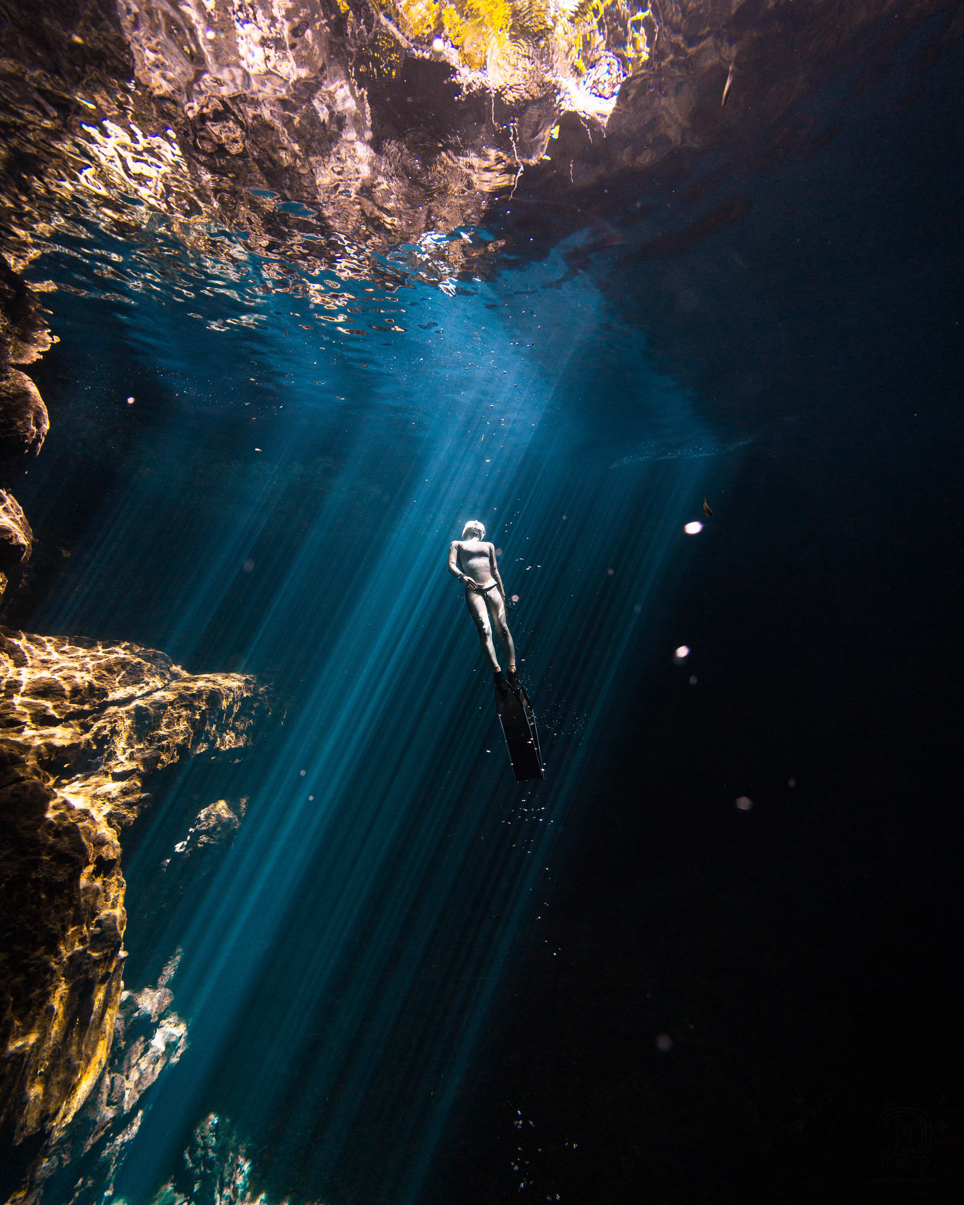 Scuba diver swimming upwards.