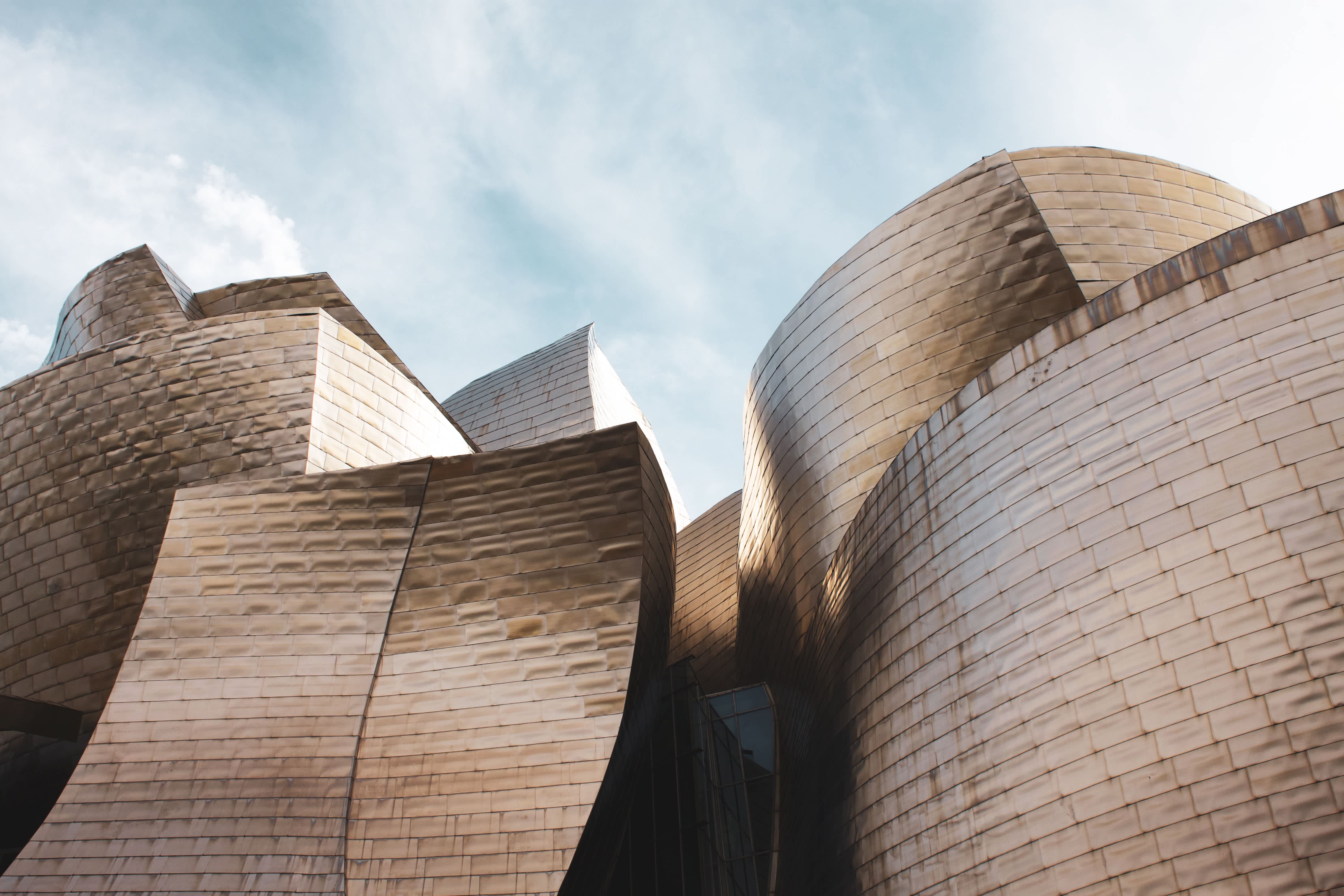 Close-up view of the metallic exterior of the Guggenheim Museum in Bilbao, Spain