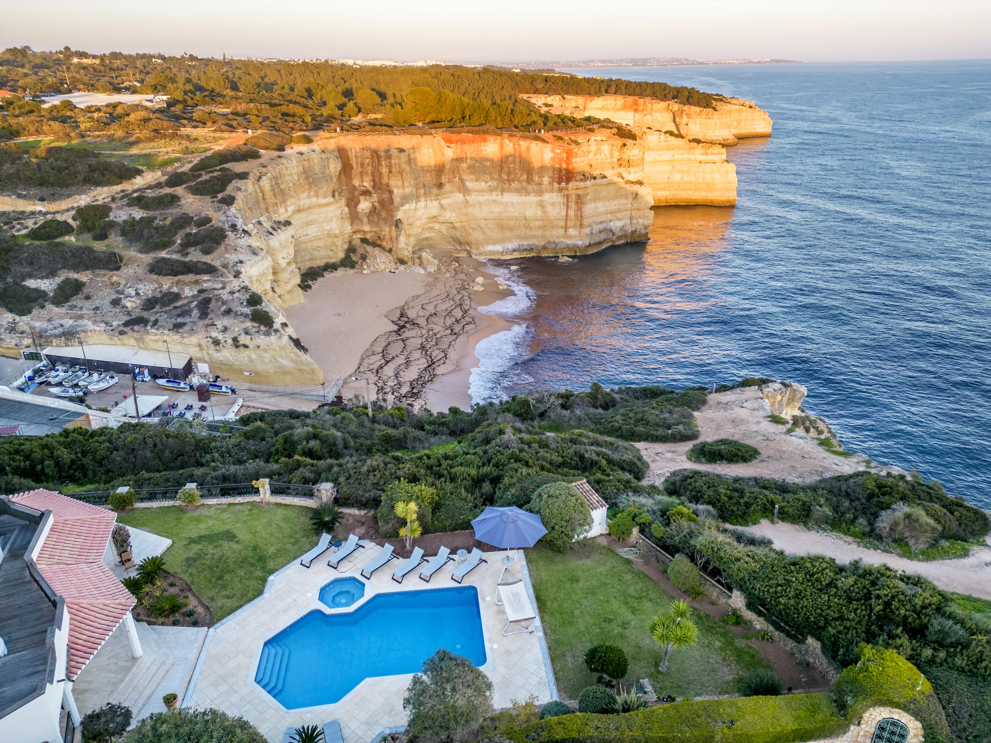 Exclusive Resorts' private villa overlooking the cliffs and beach in Algarve, Portugal.