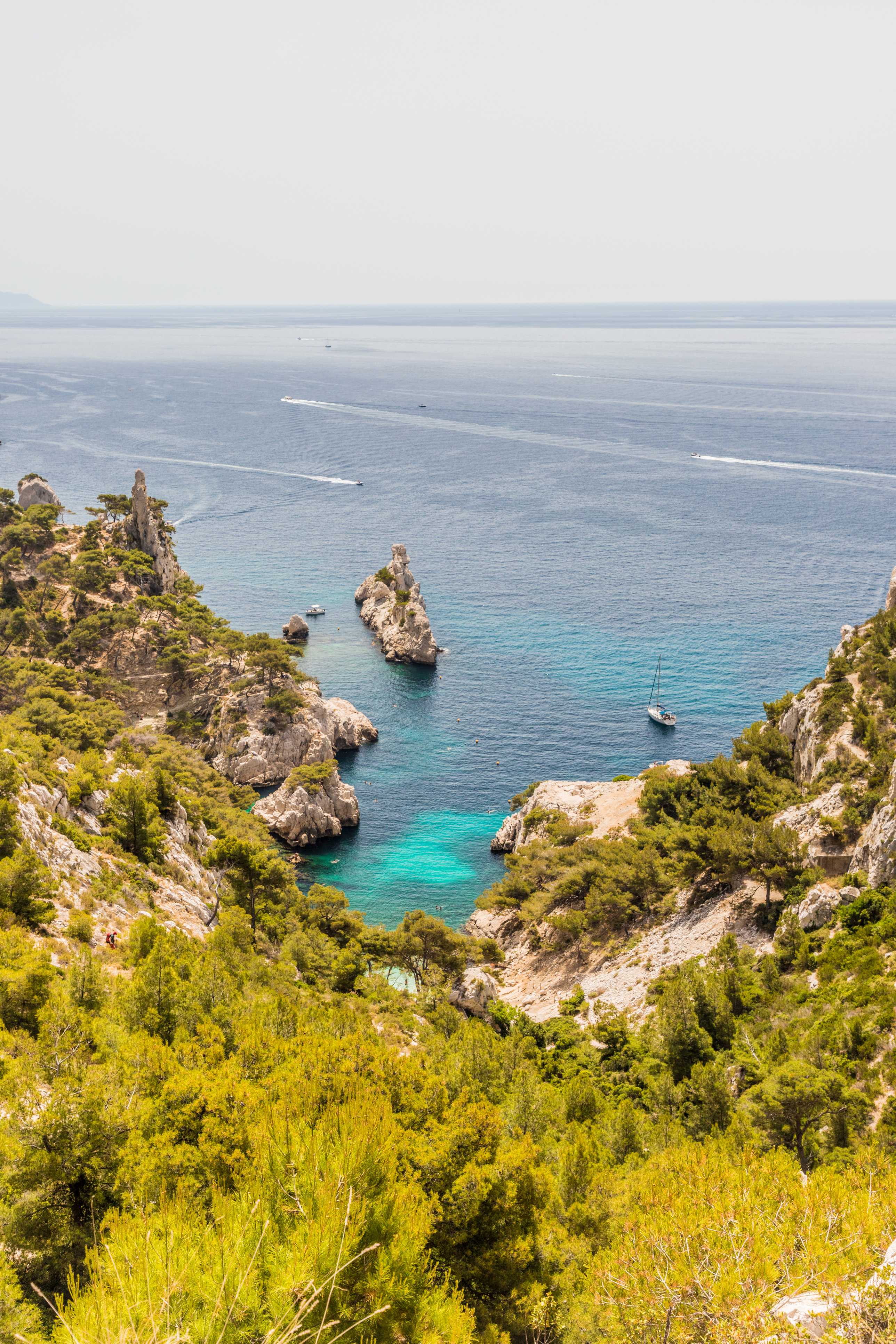 Breathtaking coastal view of the turquoise waters and rugged cliffs in Provence.
