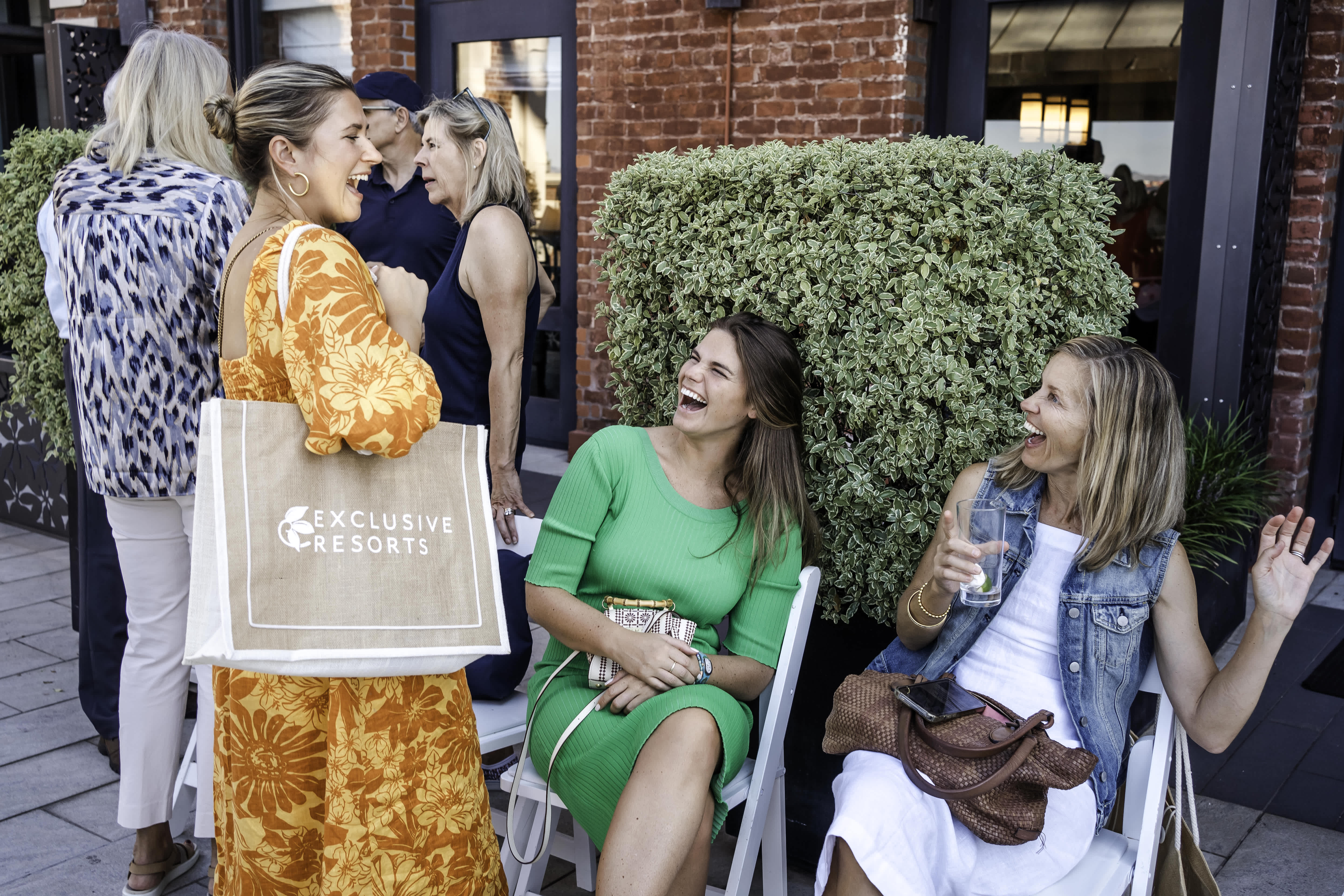 A group Exclusive Resorts' Members at an event.