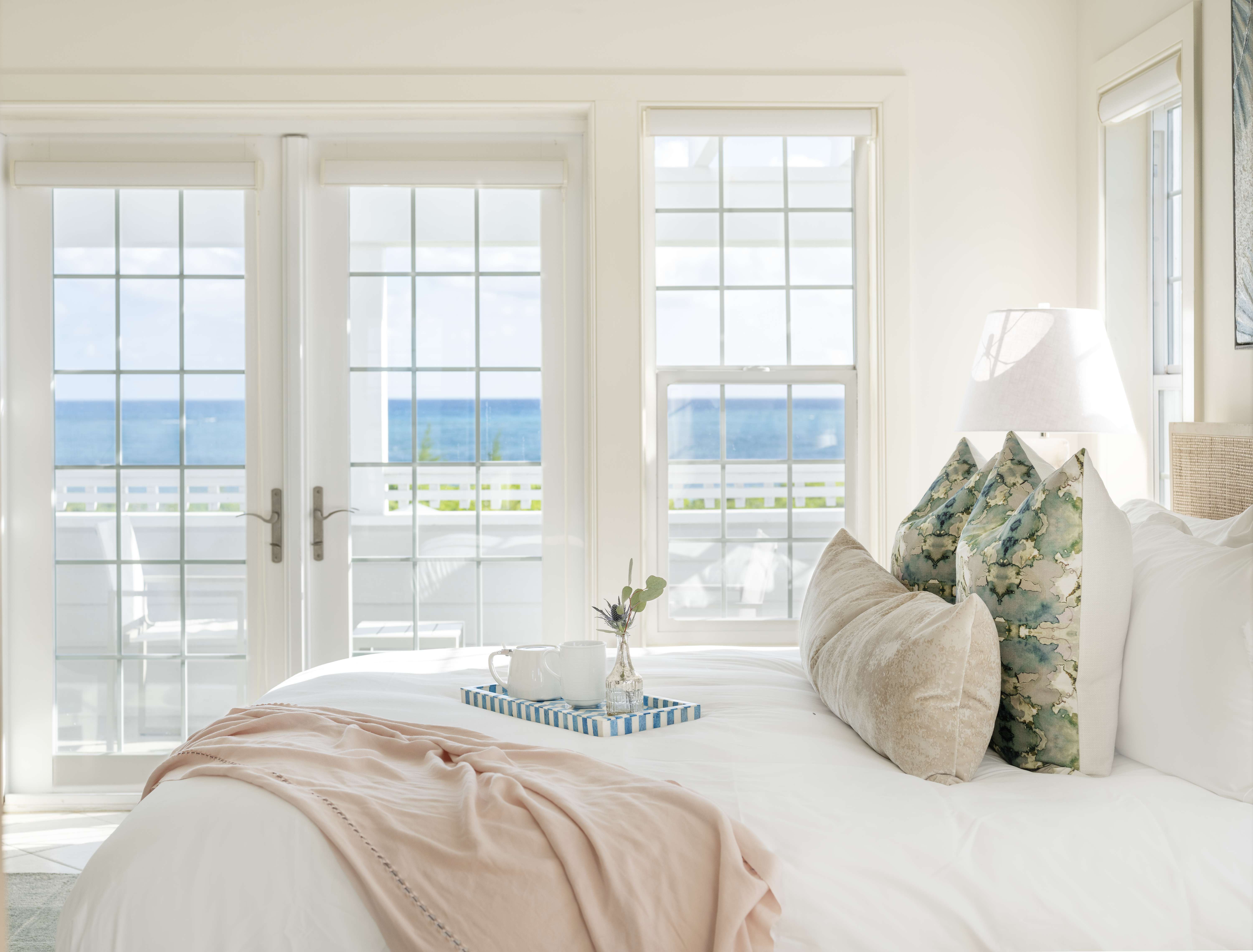 Bedroom in a private home overlooking the ocean in the Bahamas.