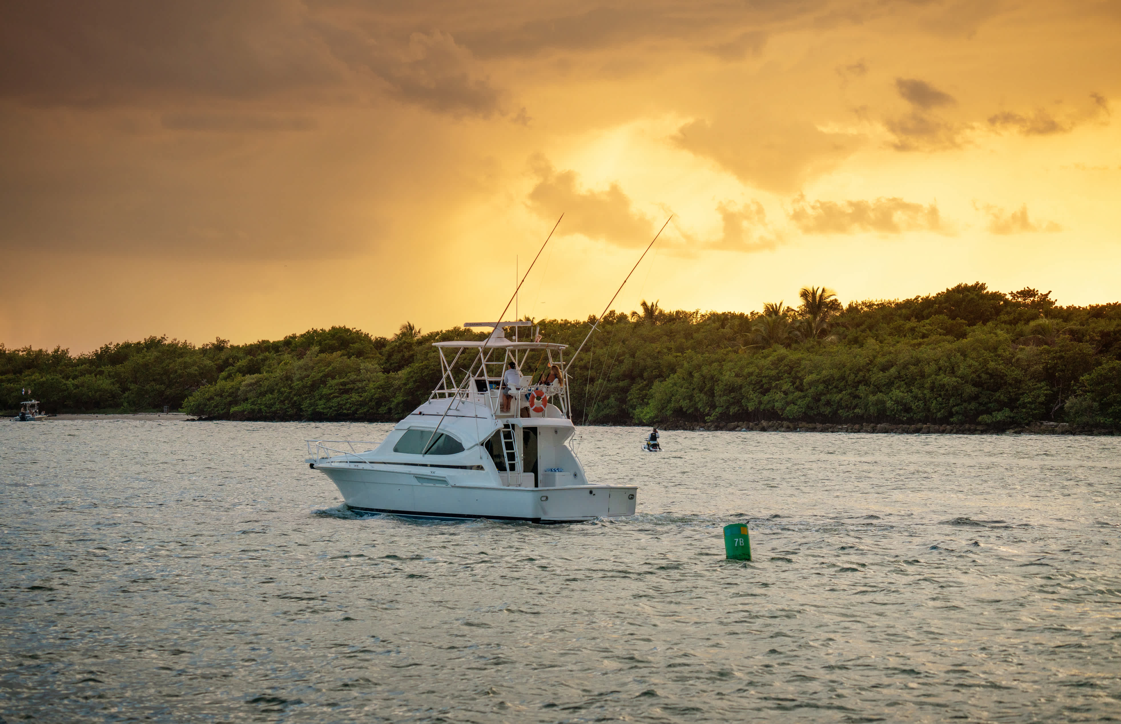 Boat on the water at sunset near Nevis with a dramatic sky in the background