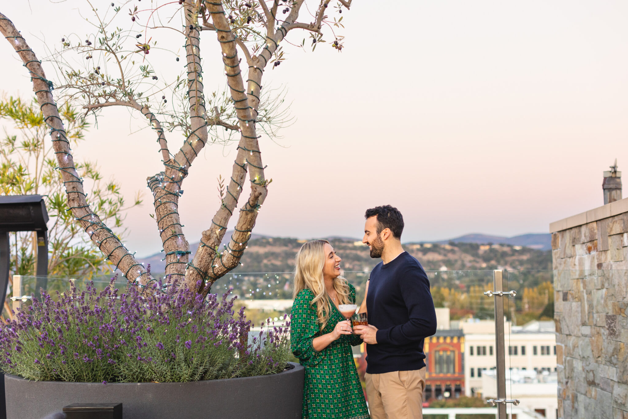 Couple enjoying a romantic moment outdoors with a vineyard view in Napa Valley