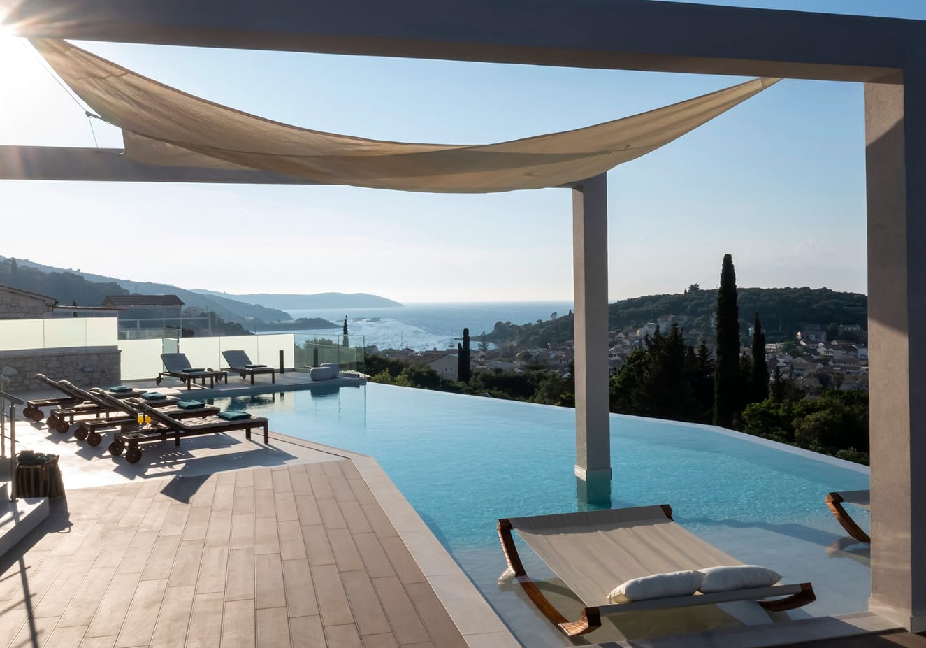 Exclusive Resorts' private villa in Corfu, Greece, with infinity pool and panoramic views of the Ionian Sea.