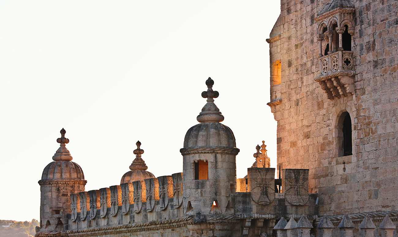 "lose-up of Belem Tower with decorative turrets at sunset in Lisbon, Portugal