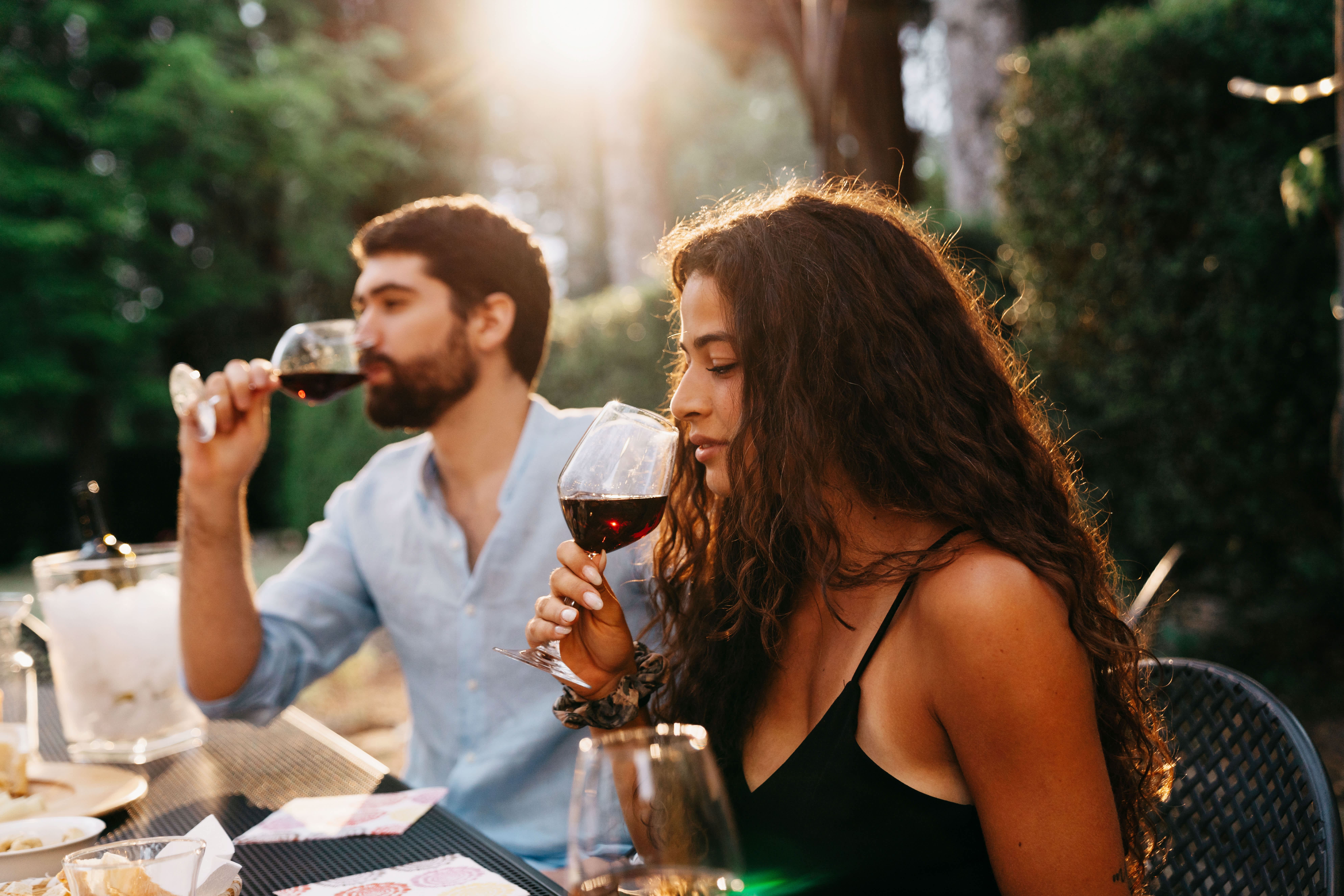 A couple enjoying wine at a restaurant in Florence, Italy