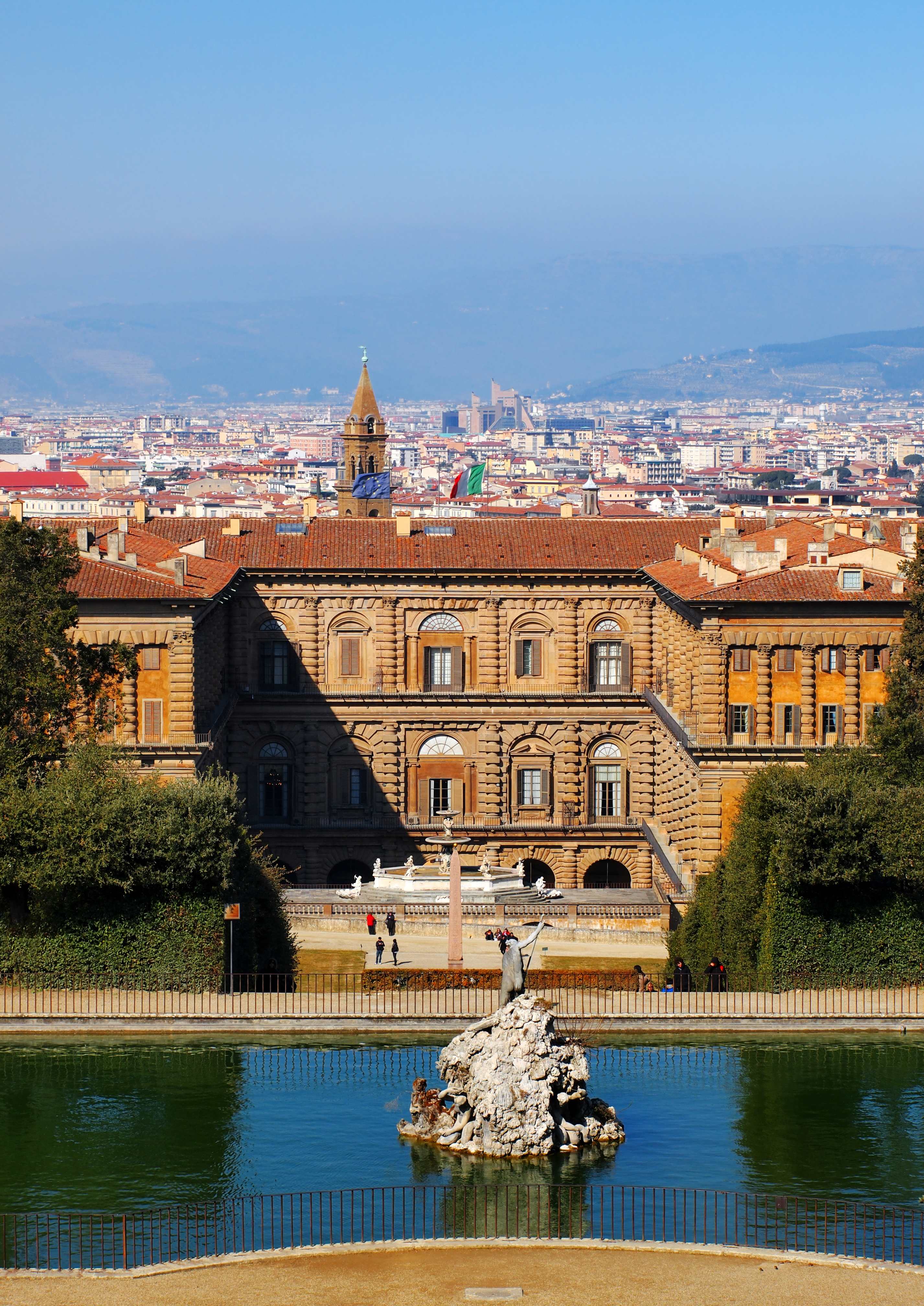 View of Pitti Palace with a fountain in the foreground and Florence skyline in the background, Florence, Italy