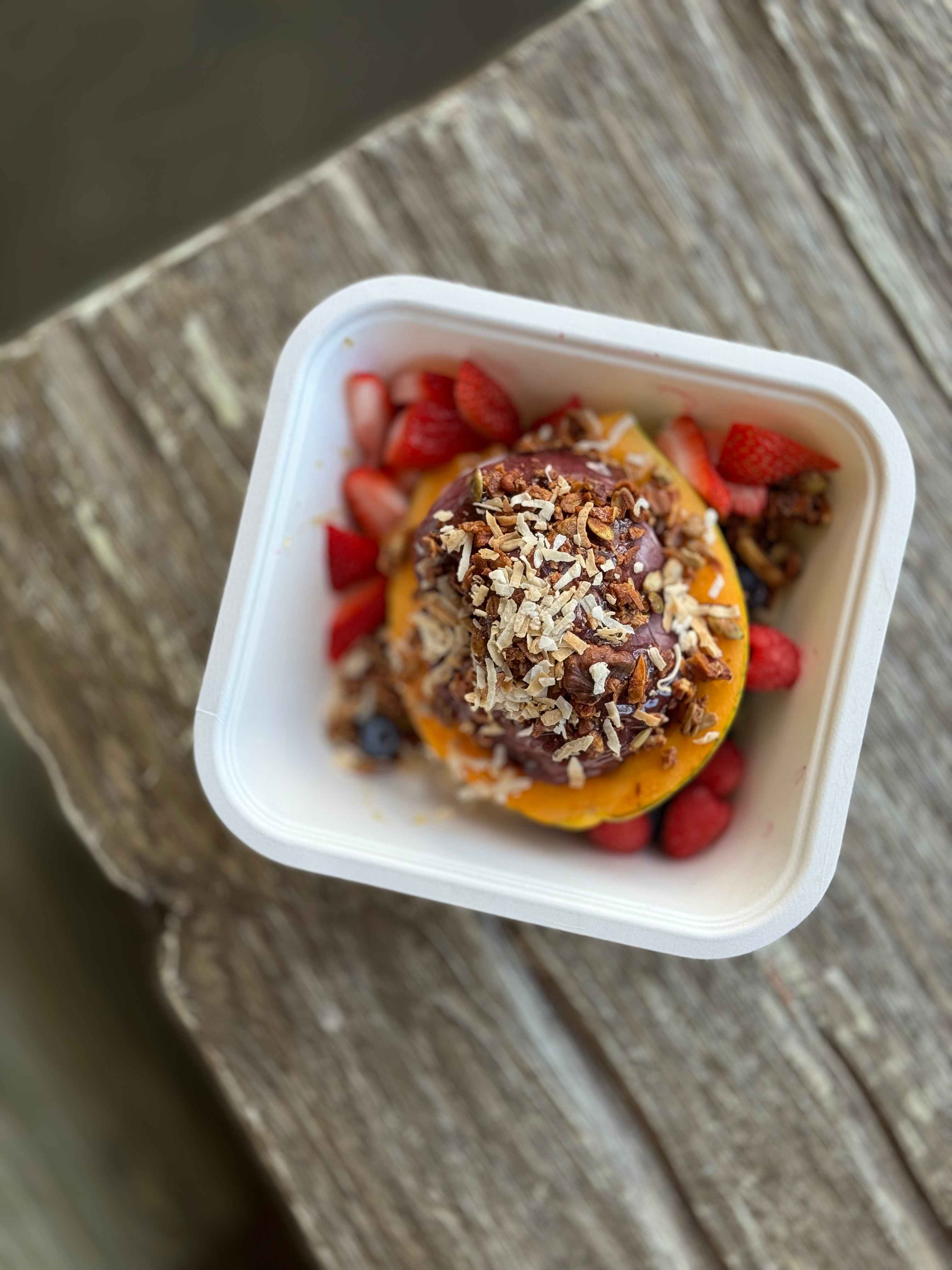 A and acai bowl topped with granola and fresh fruits on the Kohala Coast.