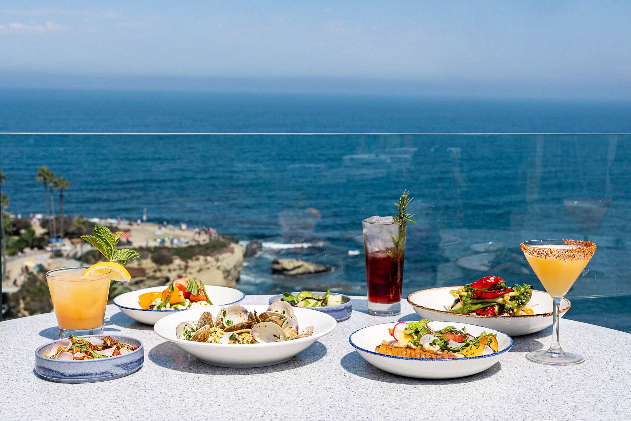 Gourmet dining setup overlooking a scenic ocean view.