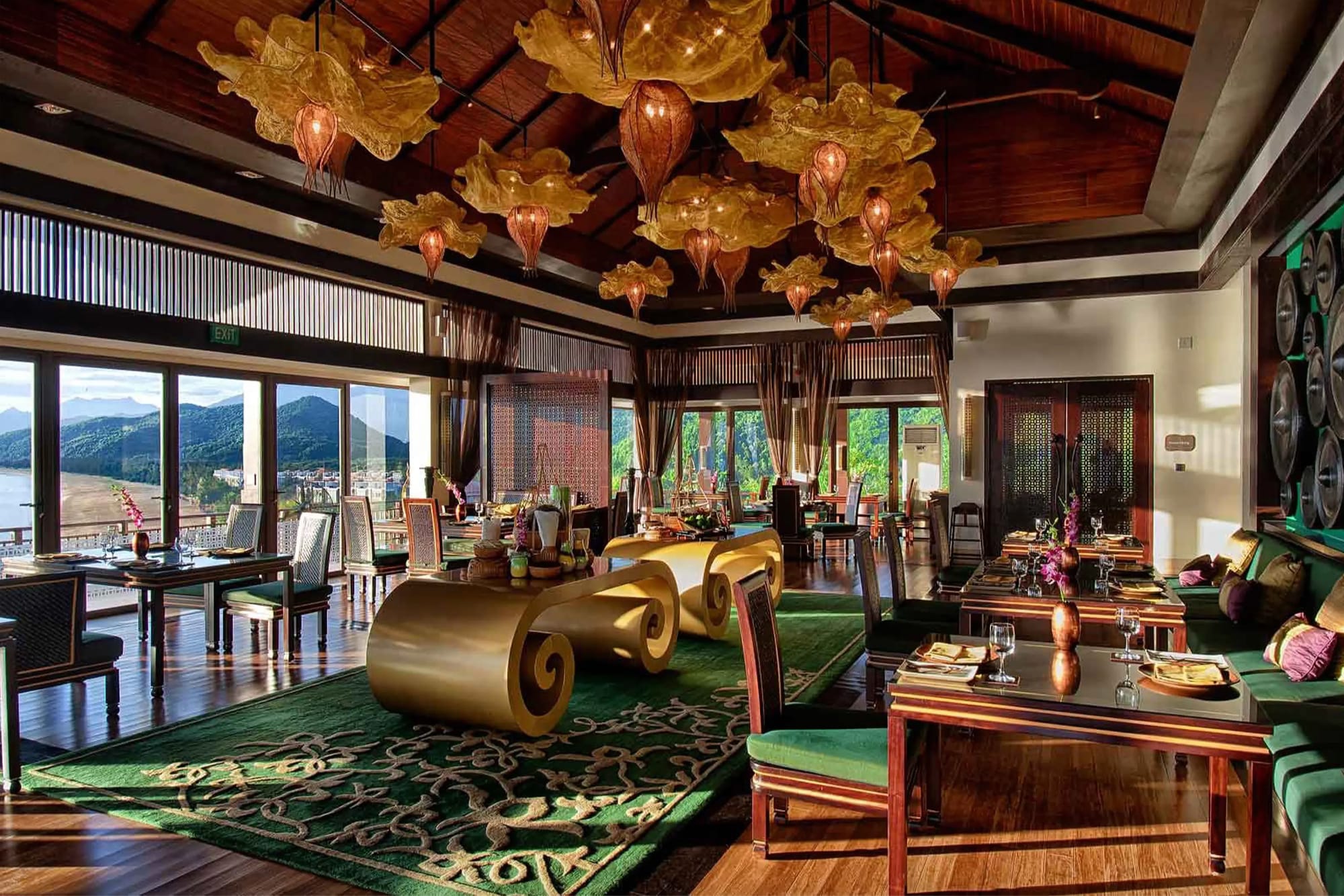 Luxurious restaurant interior with elegant decor and mountain views at Banyan Tree Lang Co, Vietnam.
