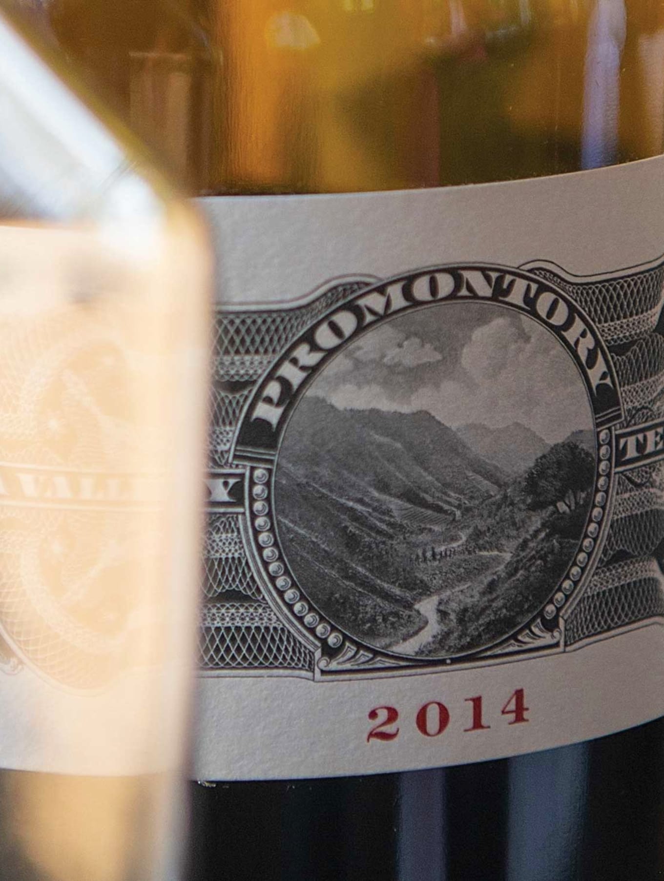Promontory Winery 2014 vintage bottle label, with intricate detailing and the Napa Valley designation, highlighting the region's renowned winemaking heritage.